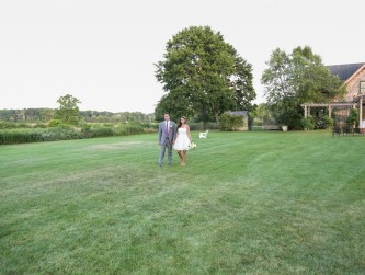 Couple from a distance walking in the lawn, Michael Priest photo